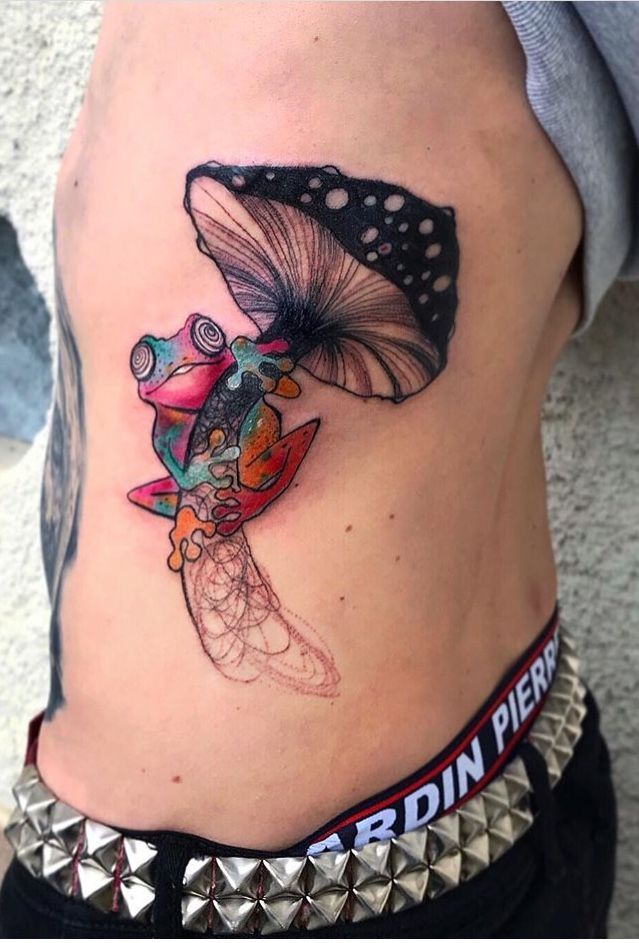 Surreal sketch frog and mushroom tattoo design for men on rib tattoo ideas