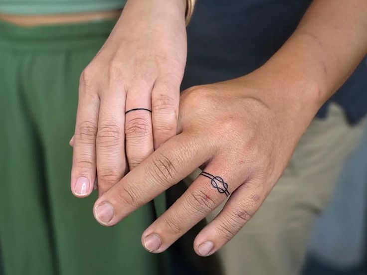 Symbolic knots tattoo design for couples on finger and wrist tattoo ideas