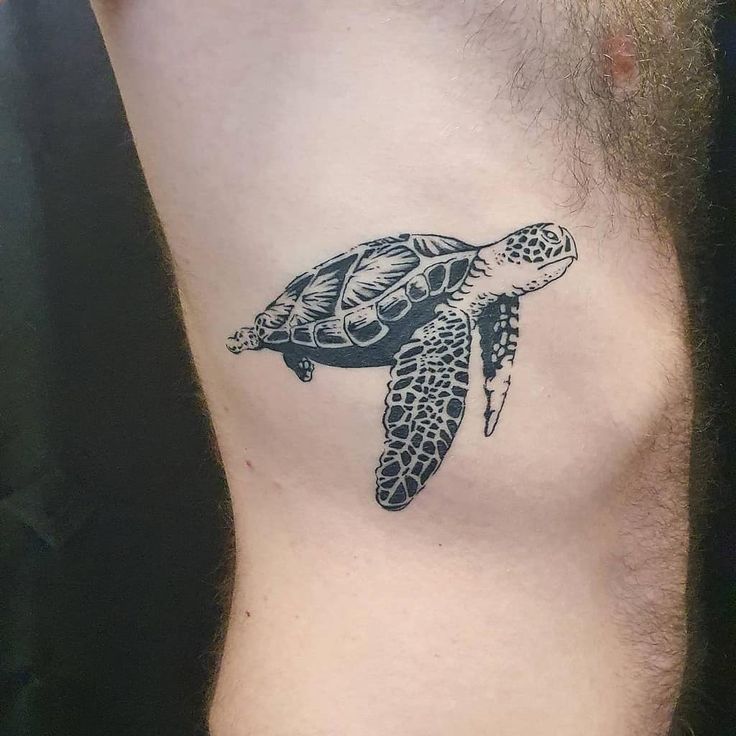 Blackwork turtle tattoo design for men on rib tattoo ideas