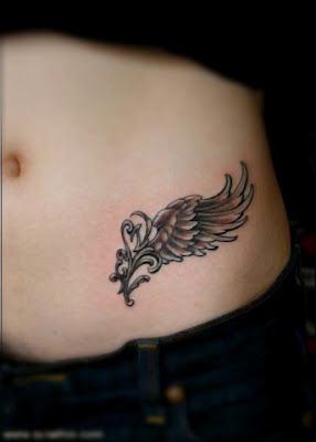 Wing with ornate filigree tattoo design for women on hip tattoo ideas