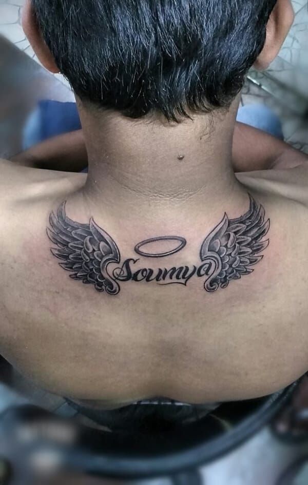 Script name tattoo design with wings and angel halo for men on neck and chest tattoo ideas