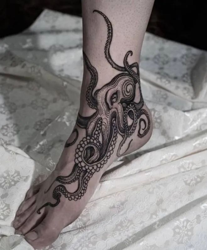 Blackwork octopus tattoo design on ankle and foot tattoo ideas