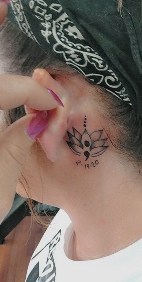 Flower and semicolon tattoo design for women behind the ear tattoo ideas