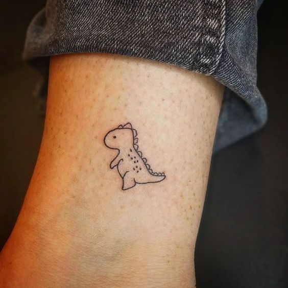 Minimalist dinosaur tattoo design for women and men on ankle tattoo ideas