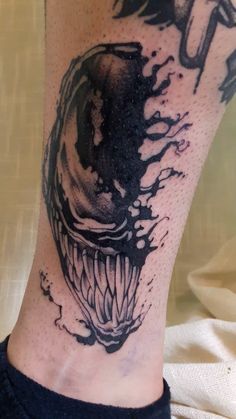 Blackwork Venom tattoo for men and women ankle tattoo ideas