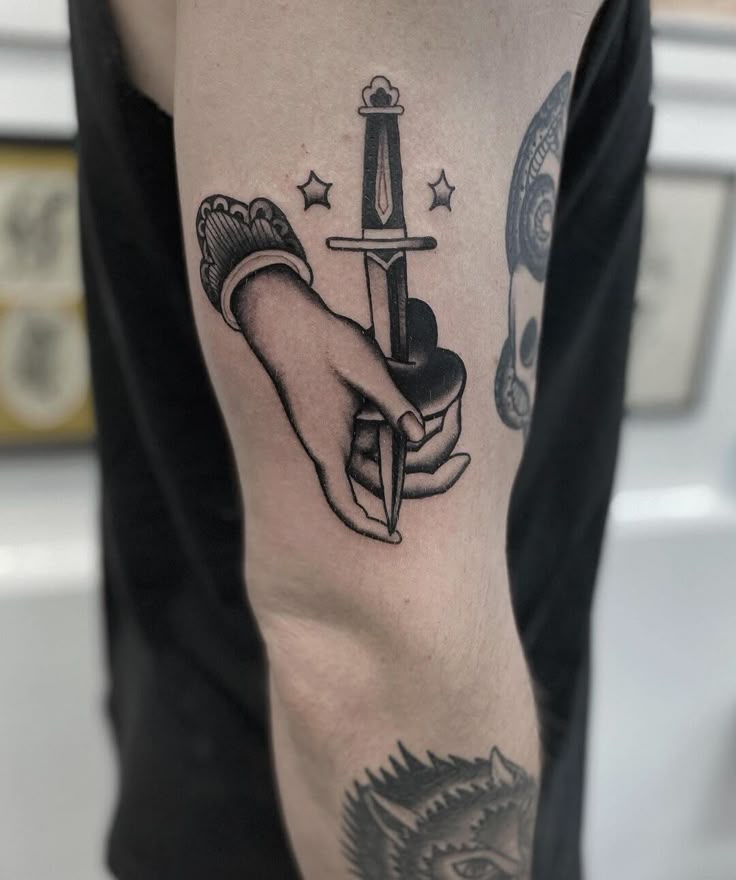 Traditional sword and star tattoo design for men on arm tattoo ideas