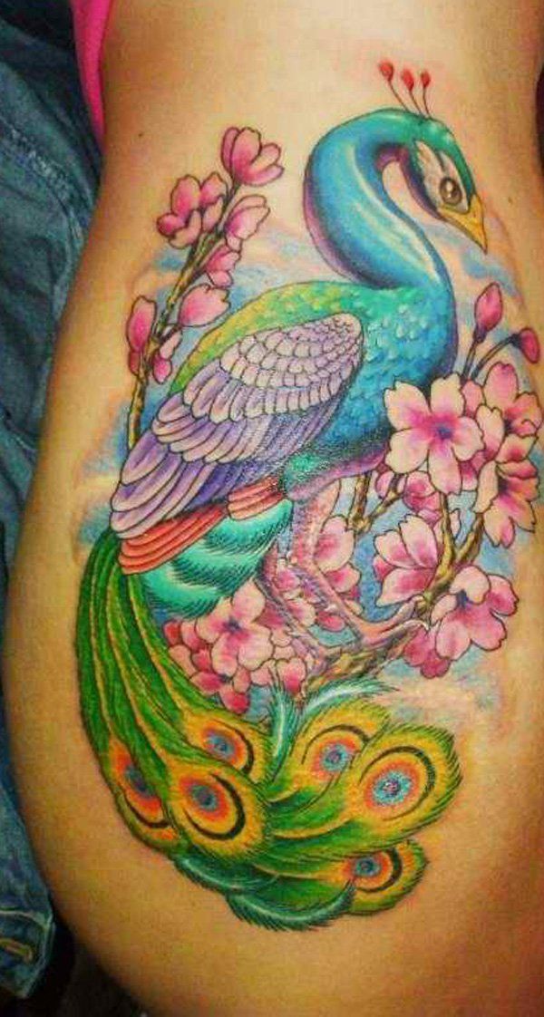 Neo-traditional peacock and flower tattoo design for women on hip tattoo ideas