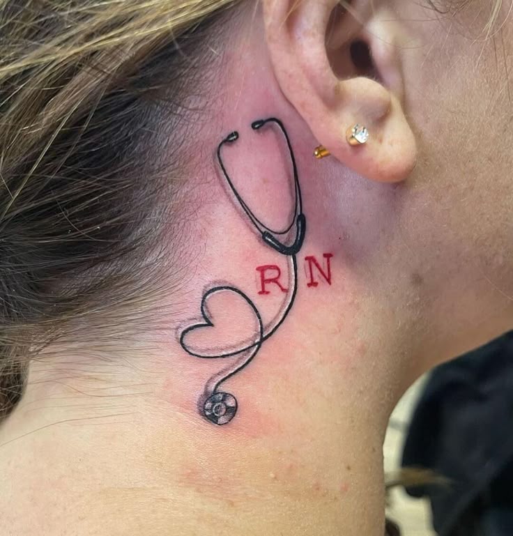 Fine line stethoscope and heart RN tattoo design for women behind the ear tattoo ideas