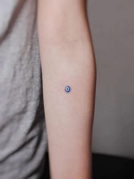 Fine Line evil eye tattoo design for women on forearm tattoo ideas