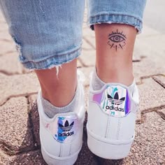 Minimalist eye and star tattoo design for women on ankle tattoo ideas