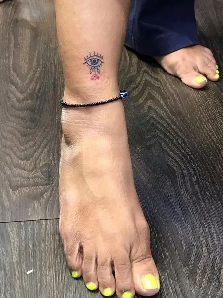 Fine Line eye and flower tattoo design for women on ankle tattoo ideas