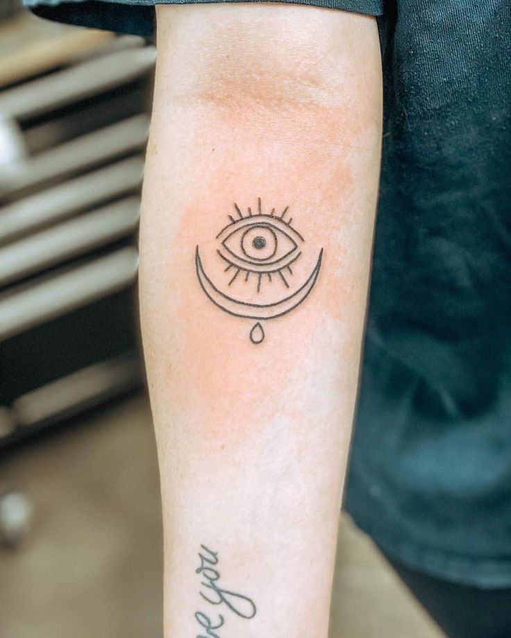 Fine line eye and moon tattoo design for women on arm tattoo ideas