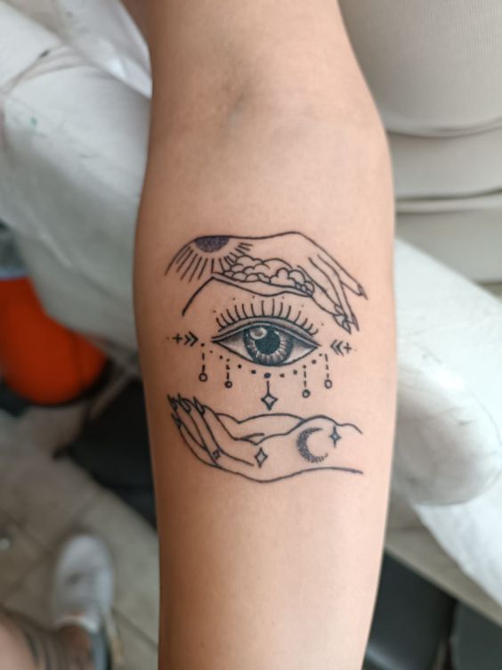 Fine line eye, moon, and sun tattoo design for women on forearm tattoo ideas