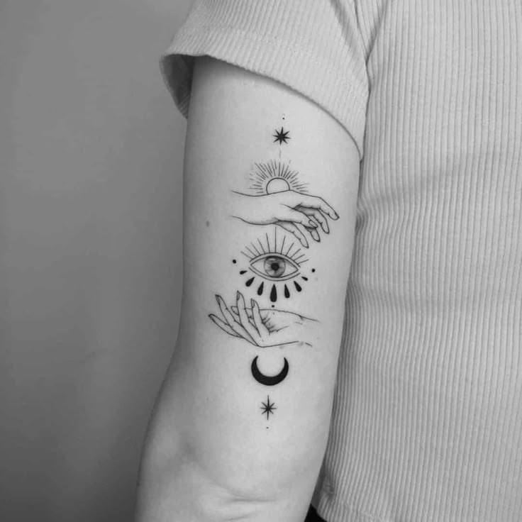 Fine Line eye, sun, moon, and star tattoo design for women on arm tattoo ideas