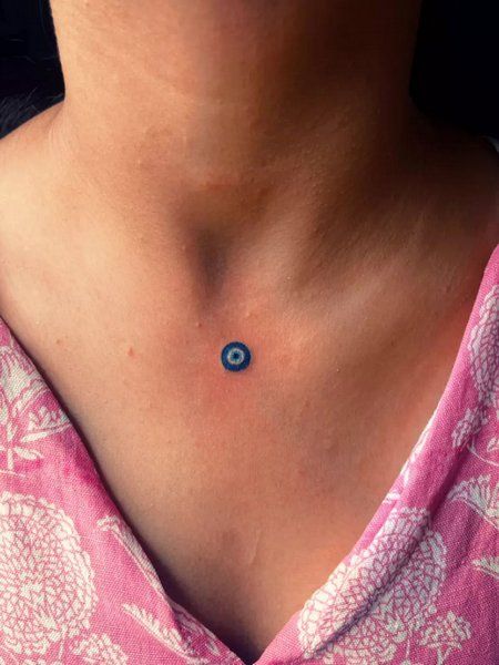 Minimalist evil eye tattoo design for women on neck tattoo ideas