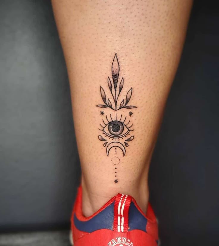 Fine Line eye, moon, and flower tattoo design for women on calf tattoo ideas