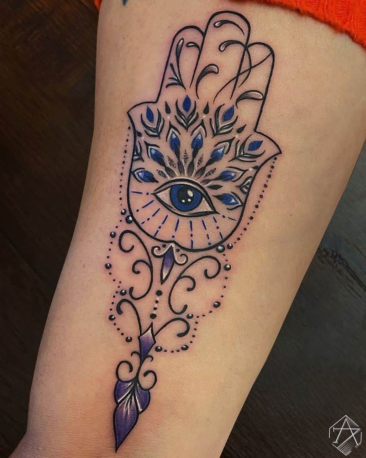 Neo-Traditional eye, flower, and feather tattoo design for women on arm tattoo ideas