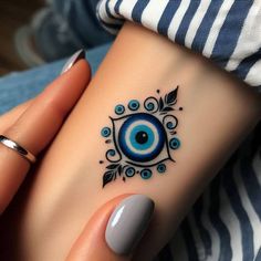 Minimalist evil eye tattoo design for women on wrist tattoo ideas